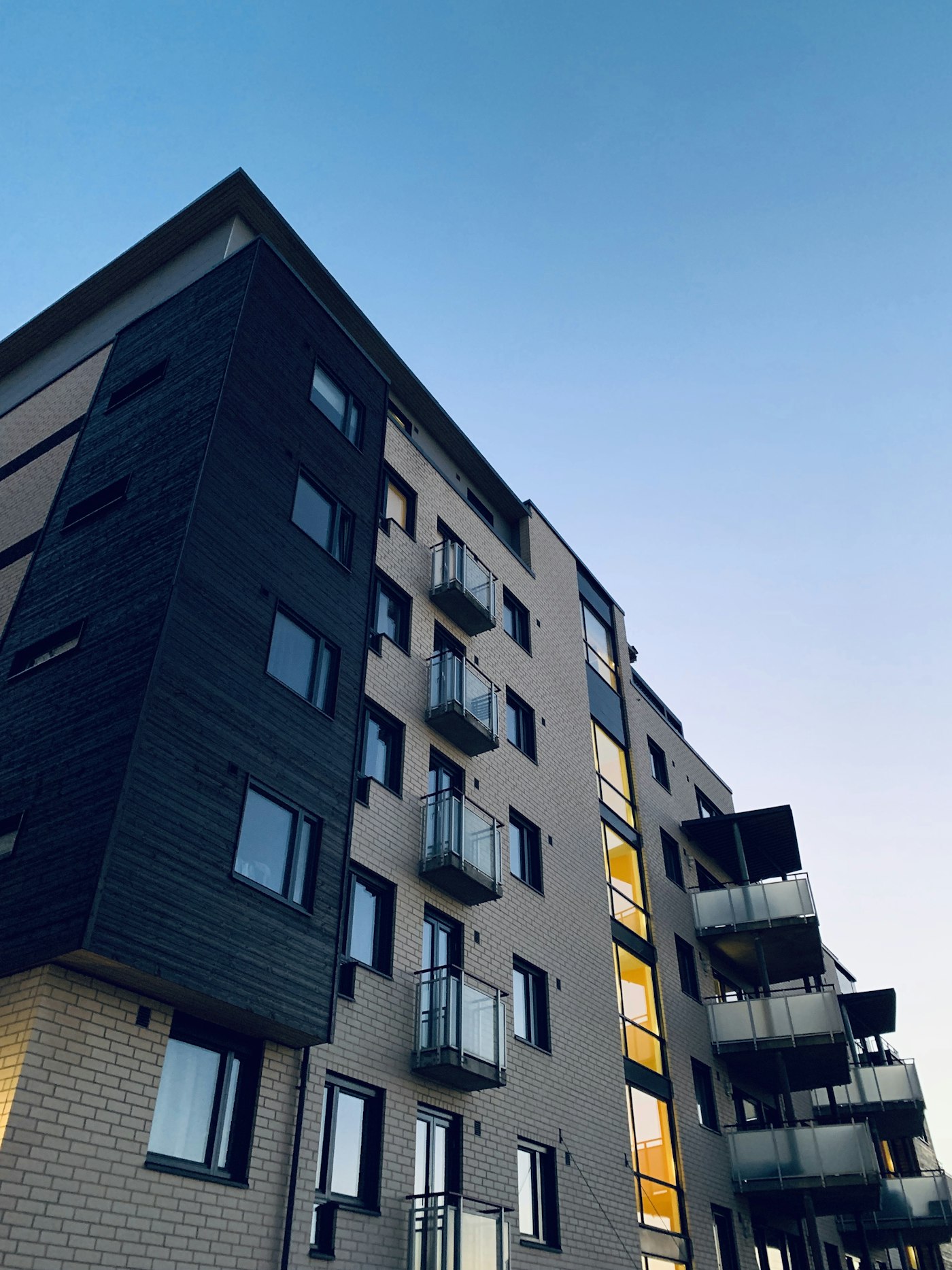 Modern apartment building with balconies — property management